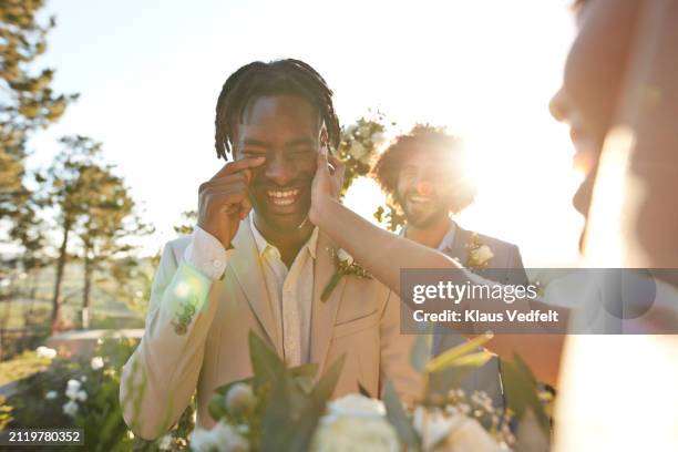bride consoling groom crying with joy - black man cries stock pictures, royalty-free photos & images