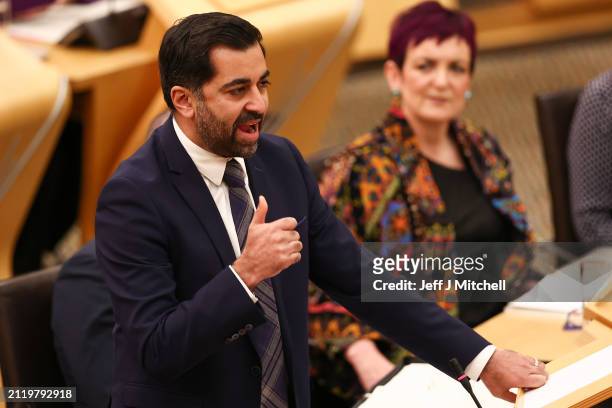 Scottish First Minister Humza Yousaf reacts as he answers questions during First Minister's Questions at Scottish Parliament at Scottish Parliament...