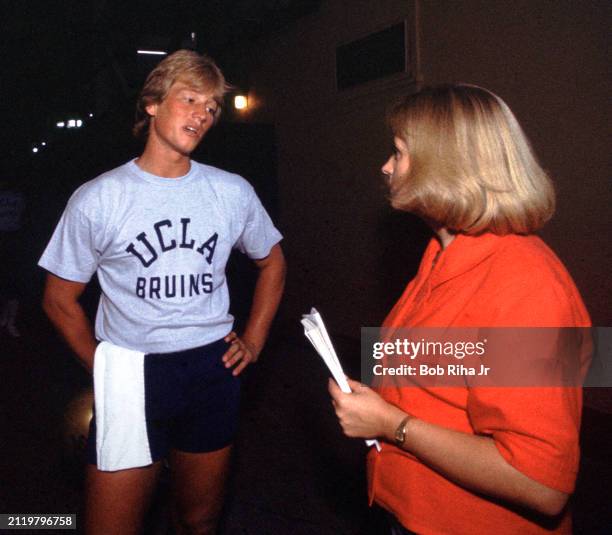 Los Angeles Times Sports Reporter Tracy Dodds talks with University of California Los Angeles Quarterback Rick Neuheisel after practice at Rose Bowl...