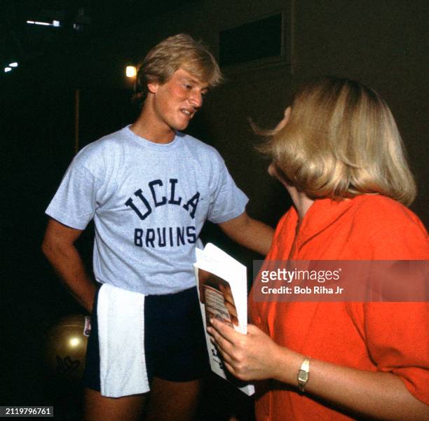 Los Angeles Times Sports Reporter Tracy Dodds talks with University of California Los Angeles Quarterback Rick Neuheisel after practice at Rose Bowl...