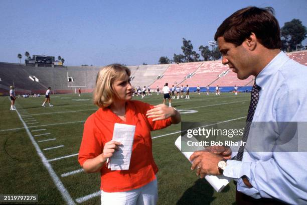 Los Angeles Times Sports Reporter Tracy Dodds interviews University of California Los Angeles Head Coach Terry Donahue after practice at Rose Bowl...