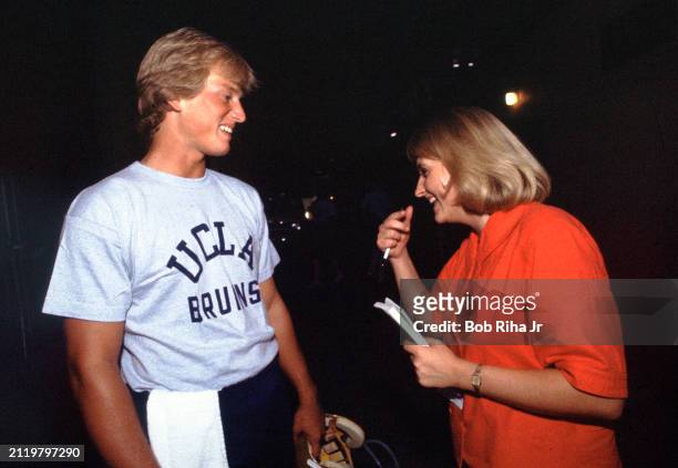 Los Angeles Times Sports Reporter Tracy Dodds talks with University of California Los Angeles Quarterback Rick Neuheisel after practice at Rose Bowl...
