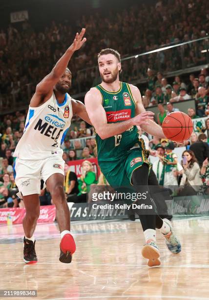 Sean Macdonald of the JackJumpers handles the ball against Ian Clark of United during game four of the NBL Championship Grand Final Series between...