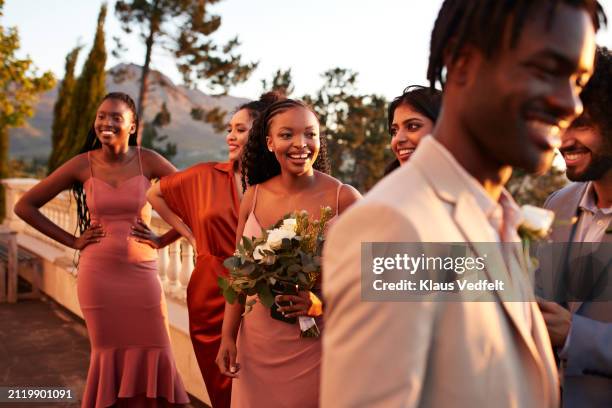 happy bridesmaids with guests and groom standing together - wedding guest stock pictures, royalty-free photos & images