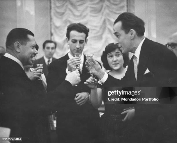 The Italian pianist Maurizio Pollini in the center, toasts to his victory at the Frederic Chopin International Piano Competition with the Polish...