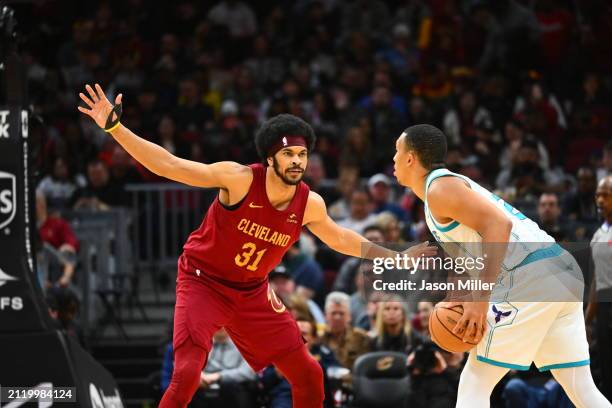 Jarrett Allen of the Cleveland Cavaliers guards Grant Williams of the Charlotte Hornets during the first half at Rocket Mortgage Fieldhouse on March...
