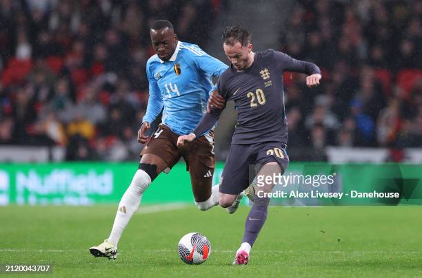 James Maddison of England holds off a challenge from Dodi Lukebakio of Belgium during the international friendly match between England and Belgium at...