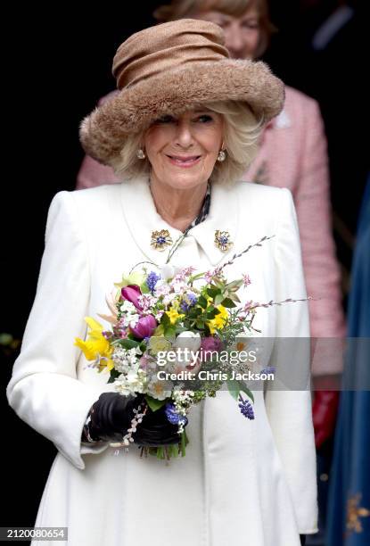 Queen Camilla holds a traditional Nosegay bouquet during The Royal Maundy Service at Worcester Cathedral On March 28, 2024 in Worcester, England. The...