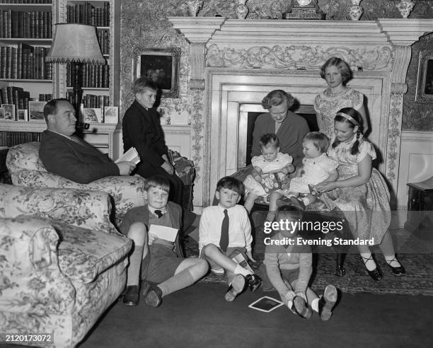 Charles Lyttelton, 10th Viscount Cobham in his living room with wife Elizabeth and eight children including John Lyttelton and Christopher Lyttelton,...