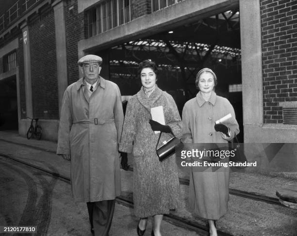 Aircraft manufacturer and aeronautical engineer Sir Richard Fairey with his daughter and wife outside a factory, January 5th 1956.