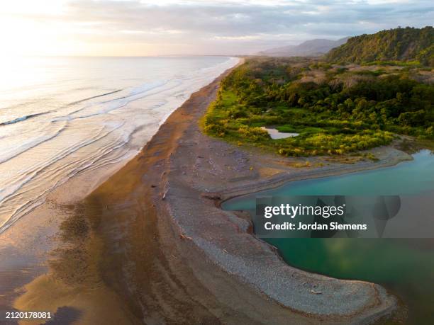 aerial view over a beach in costa rica - pazifik stock-fotos und bilder