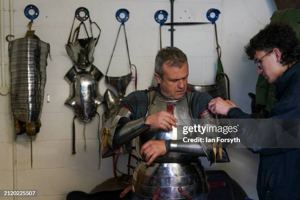 Knight has his armour fitted during a press event ahead of the 2024 Easter International Jousting Tournament held at the Royal Armouries Museum in...