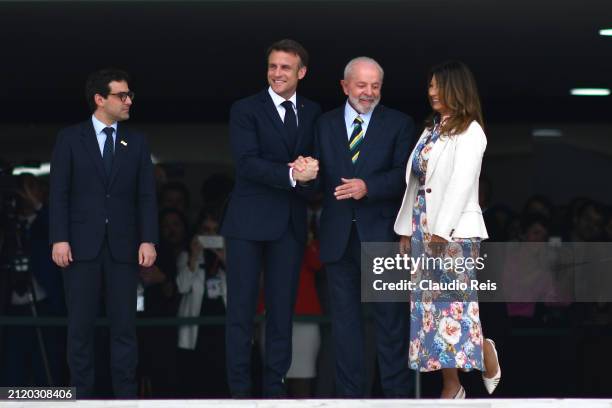 President of France Emmanuel Macron, President of Brazil Luiz Inácio Lula da Silva and First Lady of Brazil Rosangela Janja Da Silva smile during an...