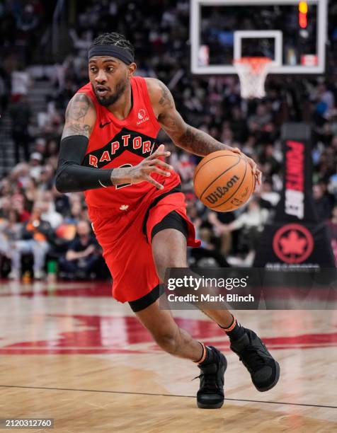 Jalen McDaniels of the Toronto Raptors dribbles against the New York Knicks during the second half of their basketball game at the Scotiabank Arena...