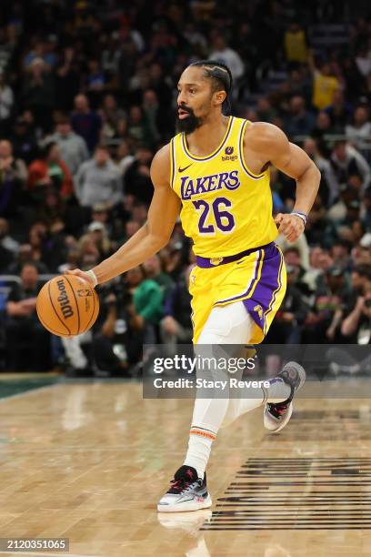 Spencer Dinwiddie of the Los Angeles Lakers handles the ball during a game against the Milwaukee Bucks at Fiserv Forum on March 26, 2024 in...