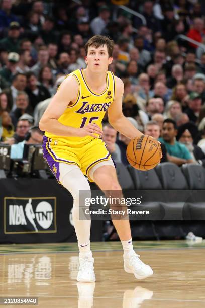 Austin Reaves of the Los Angeles Lakers handles the ball during a game against the Milwaukee Bucks at Fiserv Forum on March 26, 2024 in Milwaukee,...