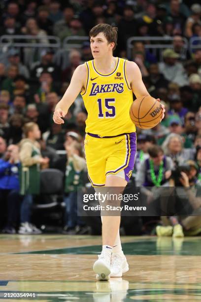 Austin Reaves of the Los Angeles Lakers handles the ball during a game against the Milwaukee Bucks at Fiserv Forum on March 26, 2024 in Milwaukee,...