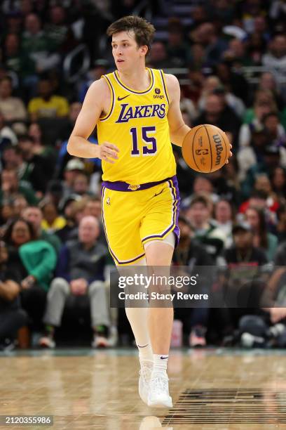 Austin Reaves of the Los Angeles Lakers handles the ball during a game against the Milwaukee Bucks at Fiserv Forum on March 26, 2024 in Milwaukee,...