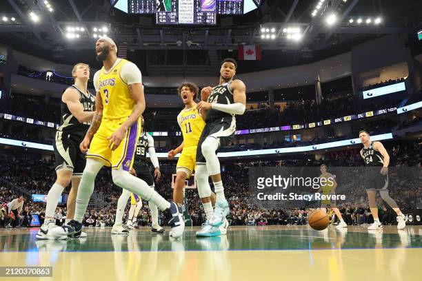 Anthony Davis of the Los Angeles Lakers reacts to a score during a game against the Milwaukee Bucks at Fiserv Forum on March 26, 2024 in Milwaukee,...