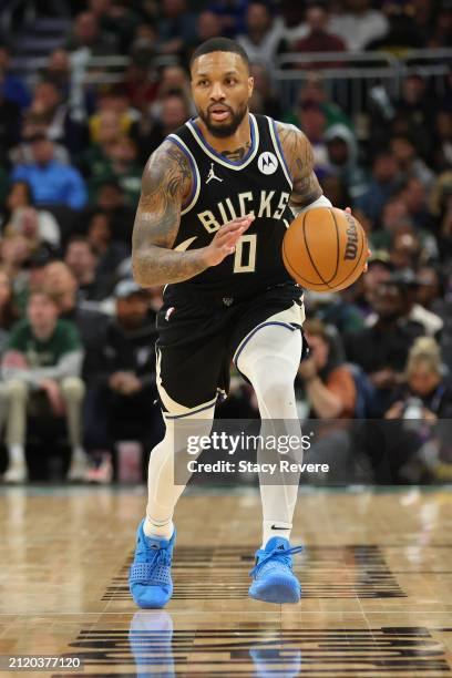 Damian Lillard of the Milwaukee Bucks handles the ball during a game against the Los Angeles Lakers at Fiserv Forum on March 26, 2024 in Milwaukee,...