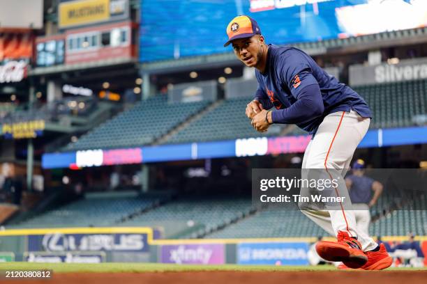 Jeremy Pena of the Houston Astros warms up before the Opening Day game against the New York Yankees at Minute Maid Park on March 28, 2024 in Houston,...