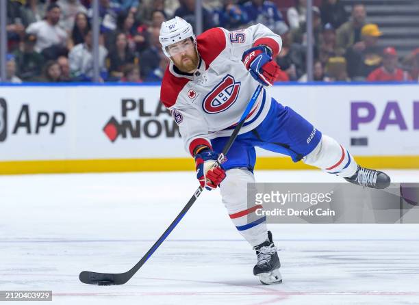 David Savard of the Montréal Canadiens skates with the puck during the third period of their NHL game against the Vancouver Canucks at Rogers Arena...
