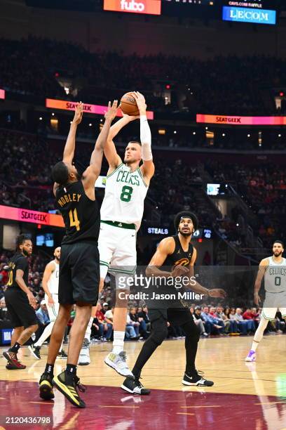 Kristaps Porzingis of the Boston Celtics shoots over Evan Mobley of the Cleveland Cavaliers during the second quarter at Rocket Mortgage Fieldhouse...