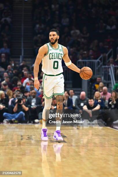 Jayson Tatum of the Boston Celtics brings the ball up court during the first half against the Cleveland Cavaliers at Rocket Mortgage Fieldhouse on...