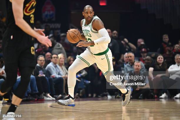 Al Horford of the Boston Celtics brings the ball up court during the first half against the Cleveland Cavaliers at Rocket Mortgage Fieldhouse on...