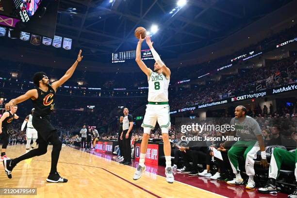 Kristaps Porzingis of the Boston Celtics shoots over Jarrett Allen of the Cleveland Cavaliers during the first half at Rocket Mortgage Fieldhouse on...