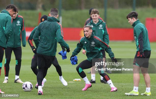 Antony, Jacob Devaney, Harry Amass of Manchester United in action during first team training session at Carrington Training Ground on March 28, 2024...