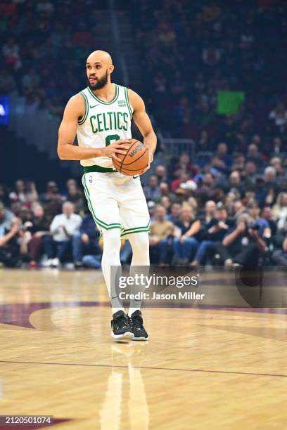 Derrick White of the Boston Celtics brings the ball up court during the first half against the Cleveland Cavaliers at Rocket Mortgage Fieldhouse on...