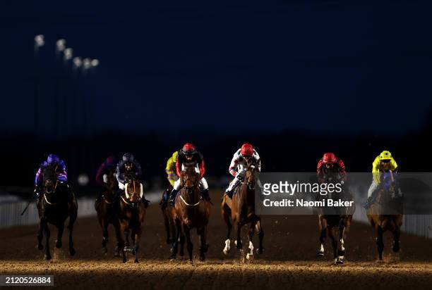Lough Leane being ridden by jockey Hayley Turner crosses the line in first during the Thursday Floodlit Flat Racing at Southwell Racecourse on March...