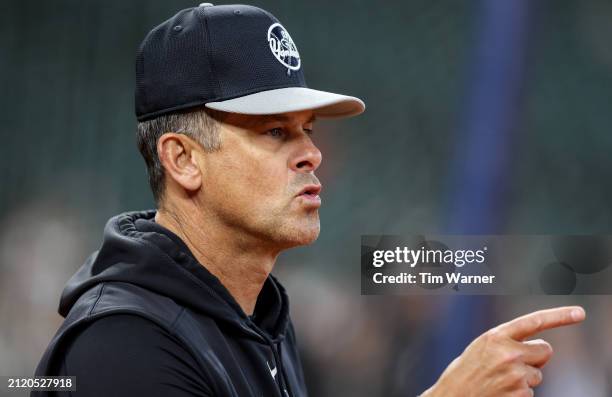 Manager Aaron Boone of the New York Yankees watches batting practice before the Opening Day game against the Houston Astros at Minute Maid Park on...