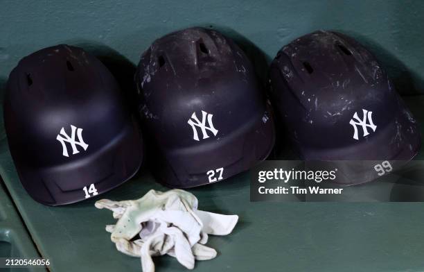 New York Yankees helmets are seen in the dugout before the Opening Day game against the Houston Astros at Minute Maid Park on March 28, 2024 in...