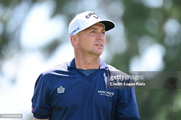 Alex Noren of Sweden watches his shot from the 12th tee during the first round of the Texas Children's Houston Open at Memorial Park Golf Course on...