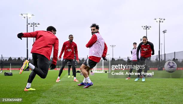 Mohamed Salah and Ryan Gravenberch of Liverpool during a training session at AXA Training Centre on March 28, 2024 in Kirkby, England.