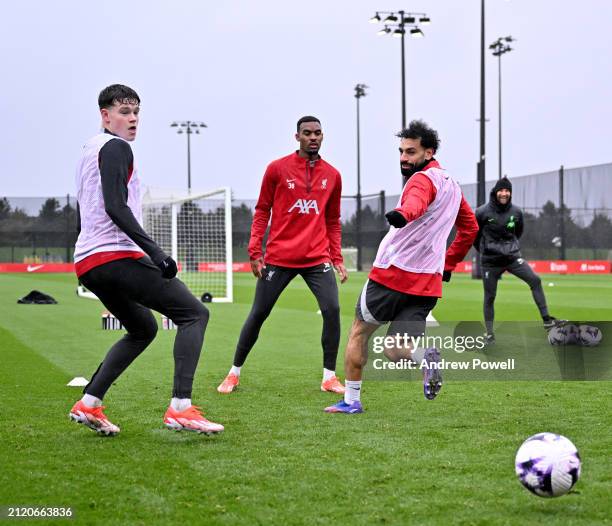 Mohamed Salah, Ryan Gravenberch and James McConnell of Liverpool during a training session at AXA Training Centre on March 28, 2024 in Kirkby,...