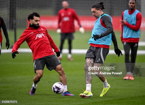 Darwin Nunez and Mohamed Salah of Liverpool during a training session at AXA Training Centre on March 28, 2024 in Kirkby, England.