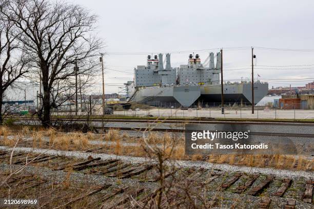 The Navy's USS Denebola and USS Antares Fast Sealift Ships sit moored unable to get underway due to the Francis Scott Key Bridge collapse in the Port...