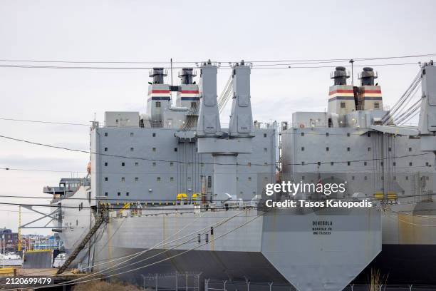 The Navy's USS Denebola and USS Antares Fast Sealift Ships sit moored unable to get underway due to the Francis Scott Key Bridge collapse in the Port...