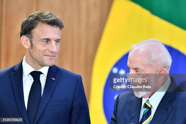 President of France Emmanuel Macron looks at President of Brazil Luiz Inácio Lula da Silva after joint signing of agreements between countries during...