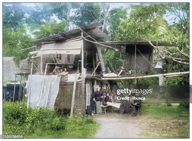 antique black and white photograph: war scene in village of northern luzon, philippines - big island hawaii islands stock illustrations