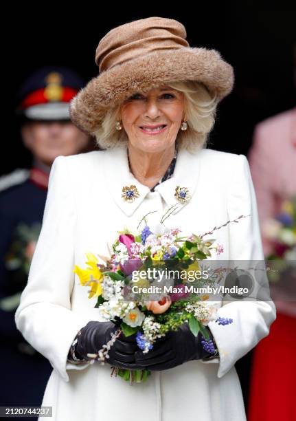 Queen Camilla carries a traditional Nosegay bouquet as she attends the Royal Maundy Service at Worcester Cathedral on March 28, 2024 in Worcester,...