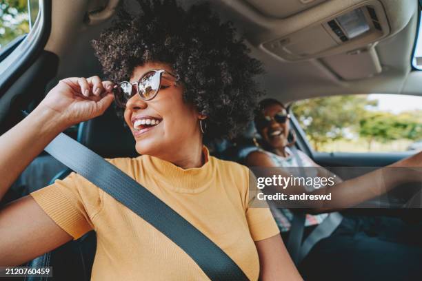 happy friends traveling by car - african american woman stock pictures, royalty-free photos & images