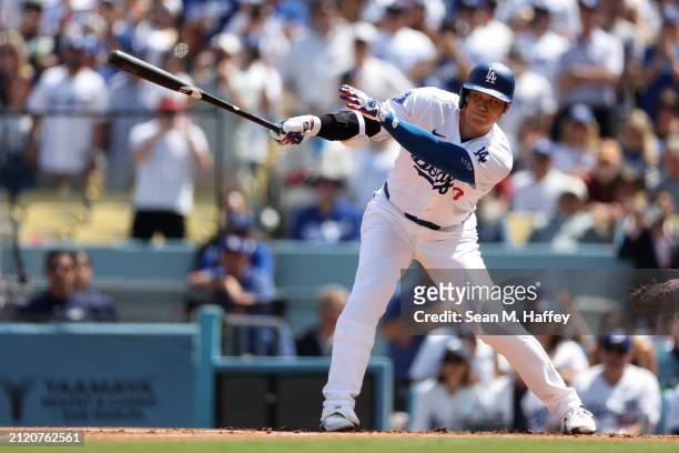 Shohei Ohtani of the Los Angeles Dodgers connects for a double during the first inning of a game against the St. Louis Cardinals at Dodger Stadium on...