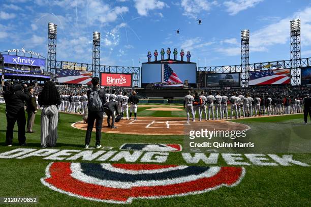 Two U.S. Army helicopter fly over Guaranteed Rate Field before the Opening Day game between the Chicago White Sox and the Detroit Tigers at...