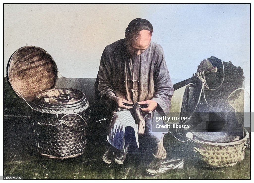 Antique black and white photograph: Chinese cobbler
