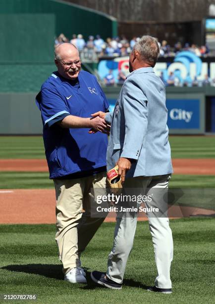 Kansas City Chiefs head coach Andy Reid shakes hands with former Kansas City Royal and Hall-of-Famer George Brett after throwing out the ceremonial...