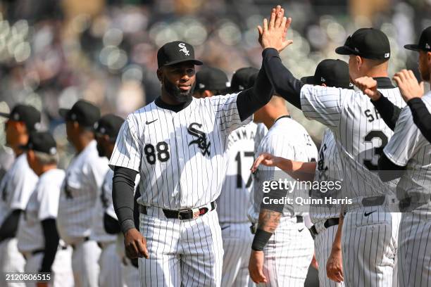 Luis Robert Jr. #88 of the Chicago White Sox celebrates with teammates after being announced before the Opening Day game against the Detroit Tigers...